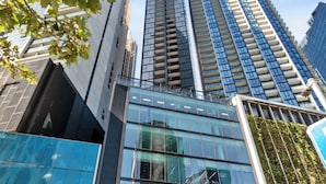 A modern building with a glass facade, labeled "Palladium Tower 245". - Heart of Southbank, Walk to Crown, Resort style amenities & Free Carpark (Southbank)