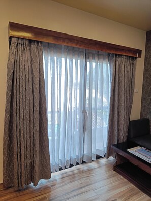 Comfort Suite, Balcony, City View | Desk, laptop workspace, blackout drapes, iron/ironing board - THE KASHI RESIDENCY  (Varanasi)