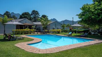 Outdoor pool, pool umbrellas, sun loungers