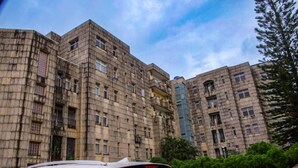 A multi-story building with a uniform exterior, featuring balconies and windows. - Gemluxe Homes (Lagos)