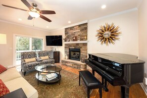 Signature House, 2 Bedrooms, Non Smoking, Kitchen | Living room | 50-inch Smart TV with digital channels