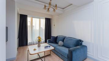 Classic Apartment | Living area | 32-inch Smart TV with cable channels