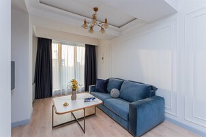 Classic Apartment | Living area | 32-inch Smart TV with cable channels