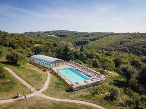 Indoor pool, seasonal outdoor pool, pool umbrellas, pool loungers