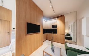 Departamento | Tabla de planchar con plancha y ropa de cama