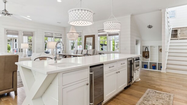 A modern kitchen with white cabinetry, stainless steel appliances, and pendant lighting. - Watercolor Home with LSV and Ping Pong (Santa Rosa Beach)