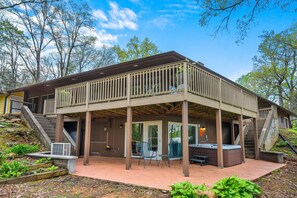 Relax on the covered patio with a hot tub and seating, or enjoy the view from the two-story balcony.
