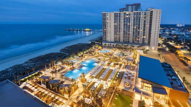 A resort with a large pool, multiple dining areas, and a view of the ocean. - Superbly Updated Ocean View Condo, 303 Brighton, Full Access 3 Bedroom Condo (Myrtle Beach)