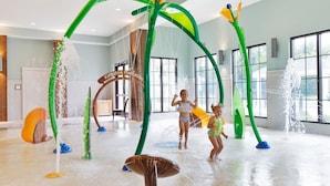 An indoor water play area with various water features and a sign reading "Kingston Plantation". - Superbly Updated Ocean View Condo, 303 Brighton, Full Access 3 Bedroom Condo (Myrtle Beach)
