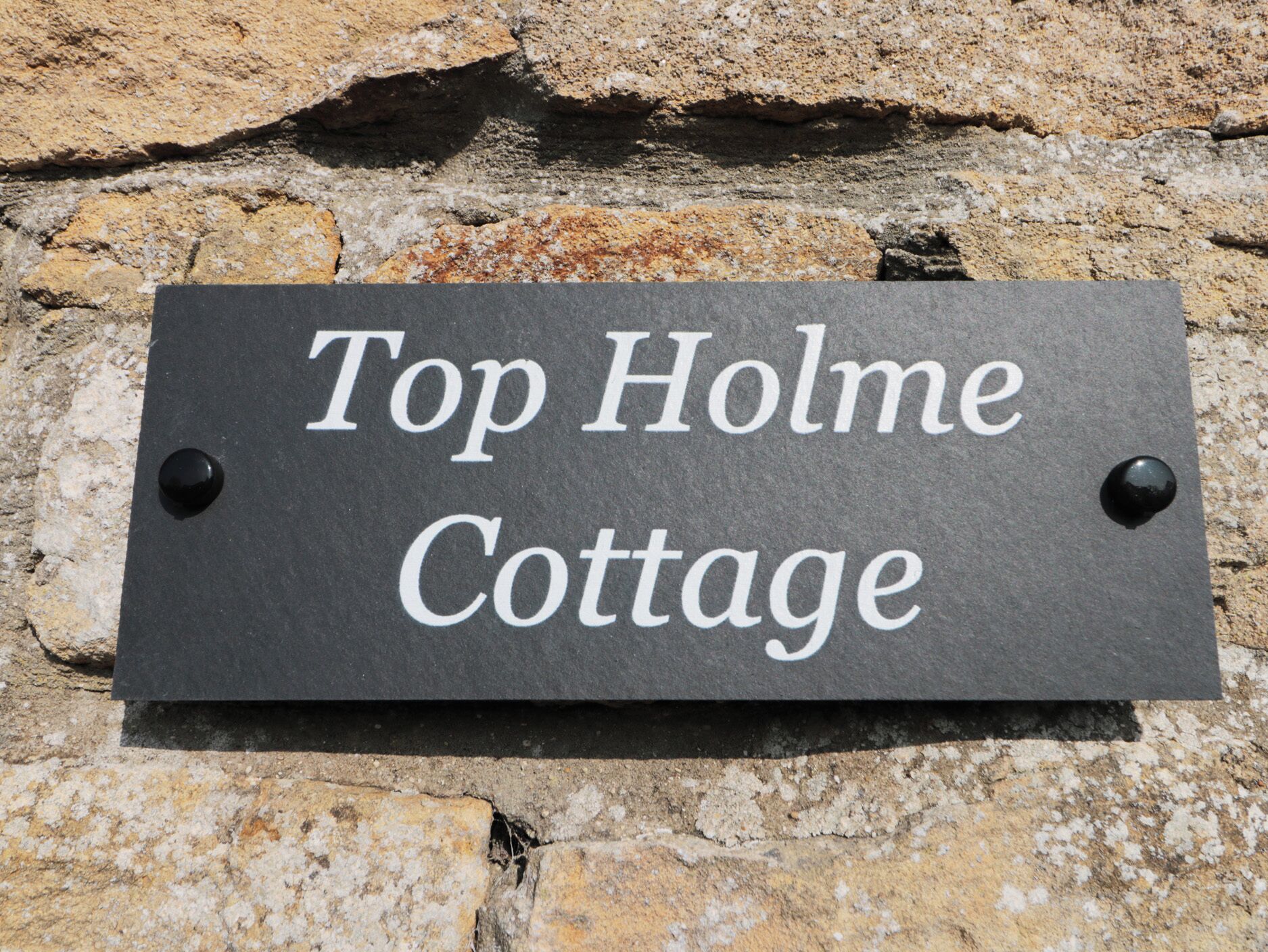 A sign for Top Holme Cottage.