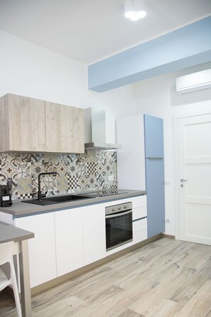 Fridge, oven, coffee/tea maker, cookware/dishes/utensils