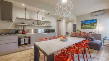 Apartment, City View | Private kitchen | Espresso maker, dining tables