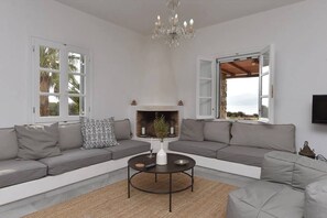 Family Apartment, Sea View, Beachfront | Living area | 40-inch TV with cable channels - Cycladic home in Kampos by GHH (Paros)