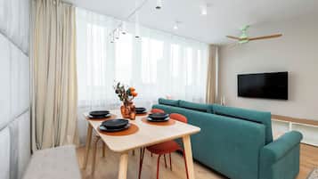 Family Apartment, City View | Living area | 50-inch Smart TV with cable channels, Netflix, streaming services