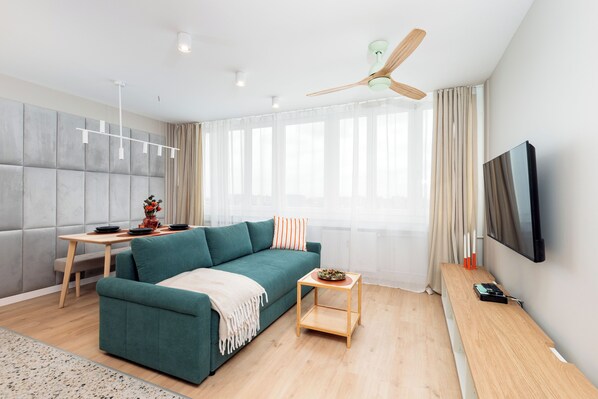 Family Apartment, City View | Living area | 50-inch Smart TV with cable channels, Netflix, streaming services