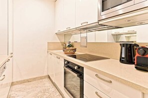 Microwave, dishwasher, coffee/tea maker, cookware/dishes/utensils