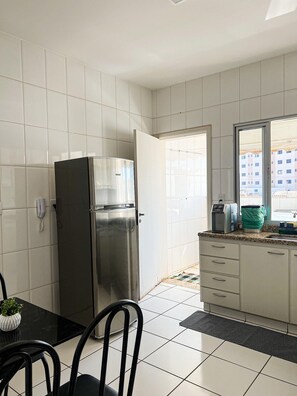 Standard Apartment | Private kitchen | Fridge, microwave, cookware/dishes/utensils, cleaning supplies