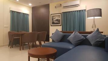 Family Suite, Courtyard View | Living area | TV
