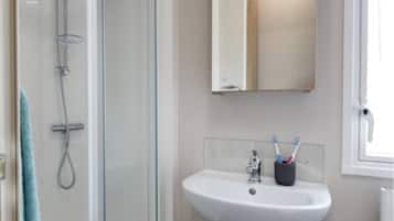 Shower, towels, soap, toilet paper
