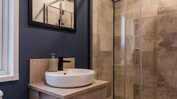 Shower, towels, soap, toilet paper