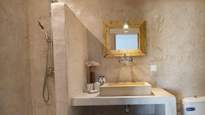 A bathroom with a wooden vanity, a large mirror, and a shower. - Villa Thea by Villa Plus (Ionian Islands)