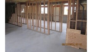 A room under construction with exposed wooden framing and a concrete floor. - Spacious 5-bedroom house with WiFi, fitness room in wonderful Hooper (Hooper)