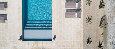 Seasonal outdoor pool, pool umbrellas, pool loungers