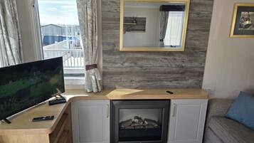 Cabin | Living area | TV, fireplace