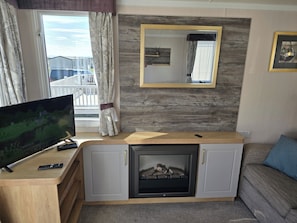 Cabin | Living area | TV, fireplace