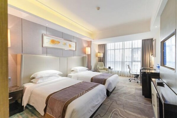 A hotel room with two beds, a desk, a chair, a TV, and a large window. - Xinhaili Hotel (Zhuhai)