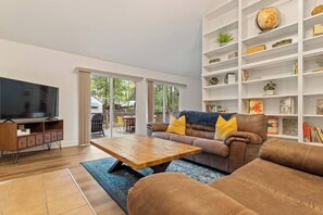 TV, fireplace, books, offices