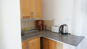 Family Studio Suite, Mountain View | Private kitchen | Shared fridge, microwave, electric kettle - Thebreeze2022 (May Pen)