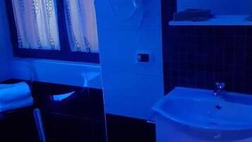 Shower, free toiletries, hair dryer, slippers