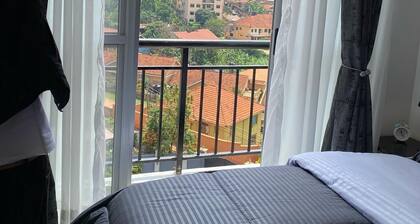 Urban View Apartment with a fully equipped gym, rooftop serene town views