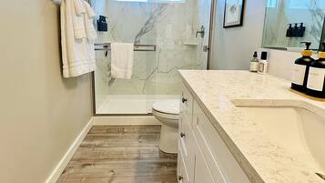 Shower, hair dryer, towels, soap