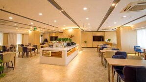 A spacious hotel lobby with a central reception desk, multiple seating areas, and a flat-screen TV mounted on the wall. - Starway Hotel (Bozhou Wanda Plaza) (Bozhou)