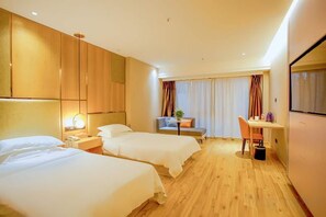 A hotel room with two beds, a desk, a chair, a TV, and a window with curtains. - Starway Hotel (Bozhou Wanda Plaza) (Bozhou)