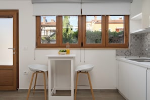 Fridge, microwave, stovetop, coffee/tea maker