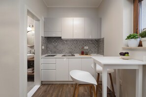 Fridge, microwave, stovetop, coffee/tea maker