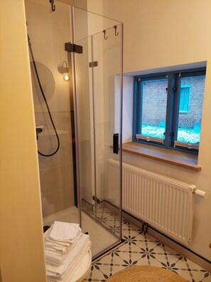 Shower, hair dryer, towels, soap