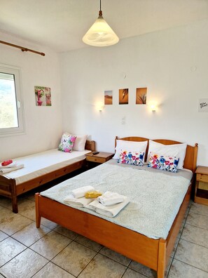 Triple Room, Garden View | In-room safe, blackout curtains, free WiFi