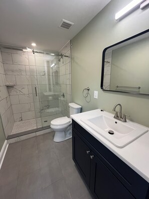 Shower, hair dryer, towels, soap