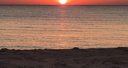 "Huron Winds" a charming 3-bedroom house just steps from Lake Huron in Oscoda