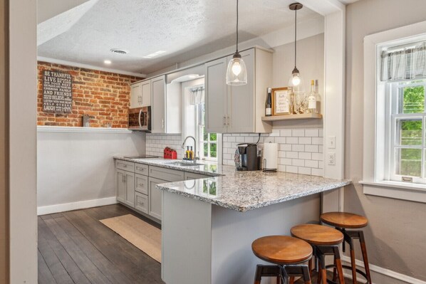 Fridge, microwave, stovetop, coffee/tea maker