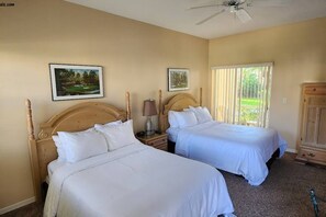 A room with two beds, a ceiling fan, and a window with blinds. - Right Direction Rentals Studio Villa 9981 (Port St. Lucie)