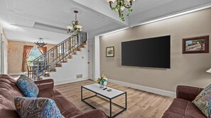 Smart TV, fireplace, table football, books