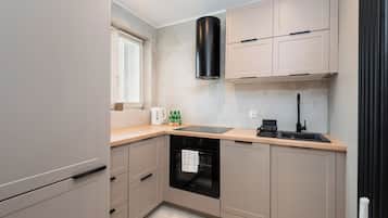 Deluxe Apartment, Balcony, City View | Private kitchen | Full-size fridge, microwave, oven, stovetop