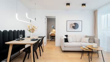 Deluxe Apartment, Balcony, City View | Living area | 50-inch Smart TV with cable channels, Netflix, streaming services