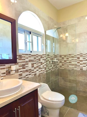 Shower, towels, soap, toilet paper