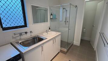 Shower, hair dryer, towels